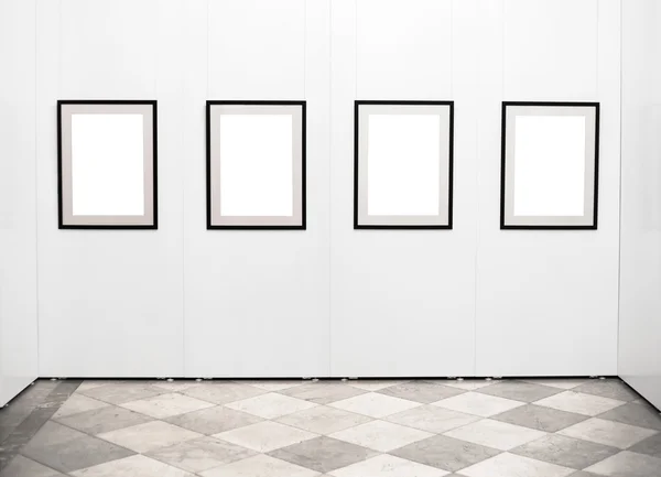 Empty picture frames on the wall in art gallery