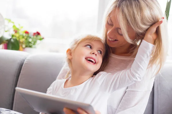 Mother and daughter using tablet