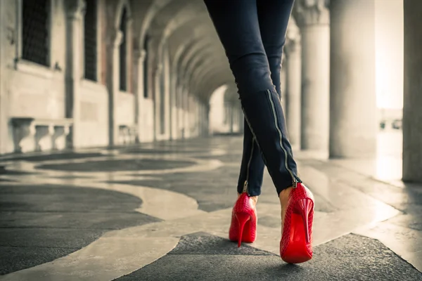 Woman in leather pants and heels