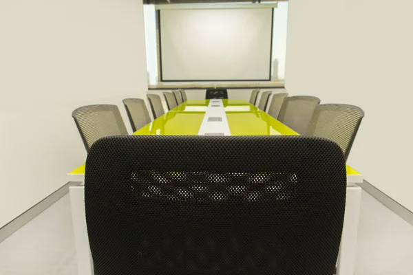 Interior conference room, meeting room, with white projector board.