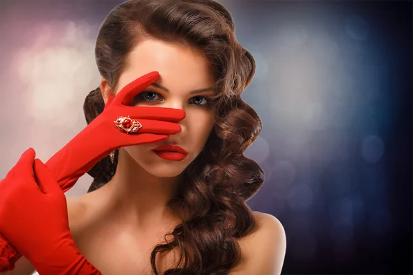 Girl Portrait. Vintage Style Mysterious Woman Wearing Red Glamour Gloves