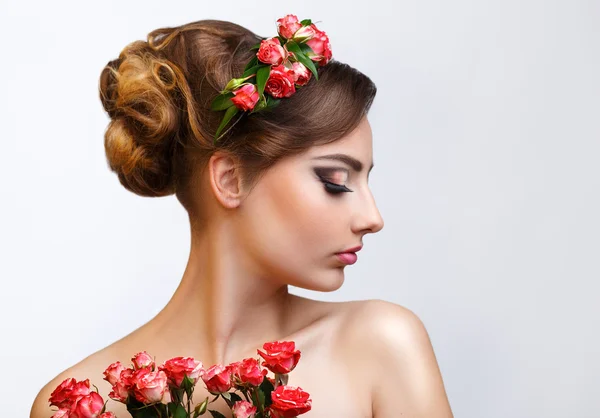 Beauty portrait of a girl with flowers