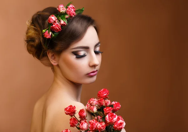 Beauty portrait of a girl with flowers