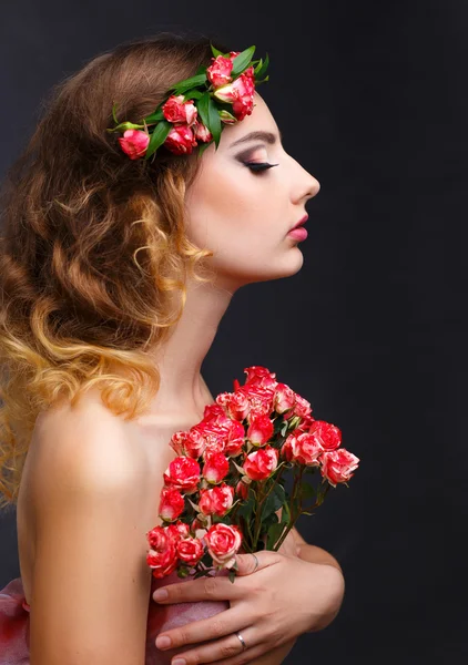 Beauty portrait of a girl with flowers