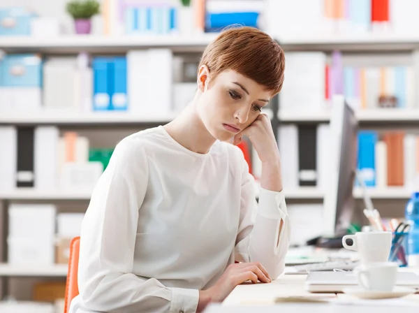 Sad woman in the office