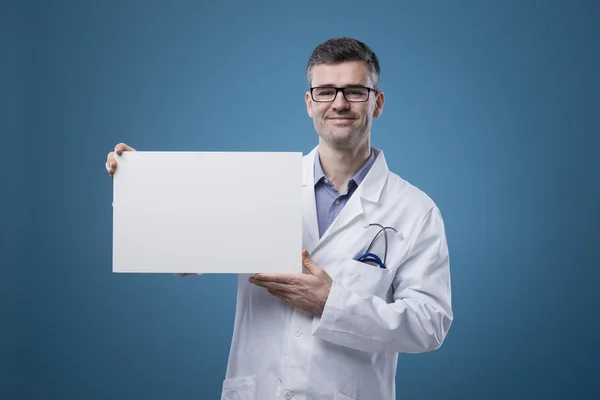 Confident doctor holding a sign