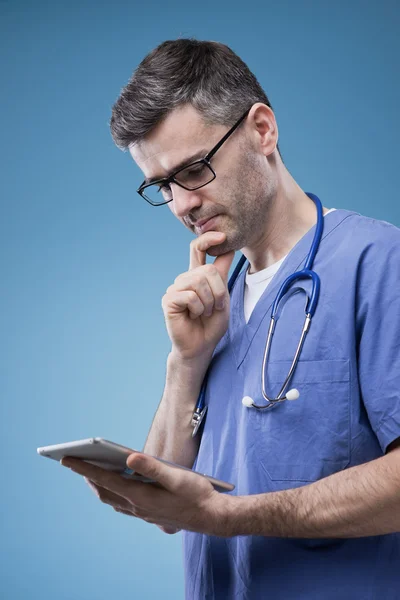 Doctor using a touch screen tablet