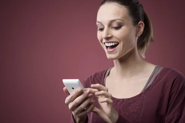 Cheerful woman with mobile phone