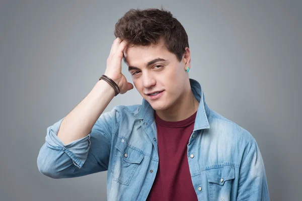 Cool teenager touching his hair