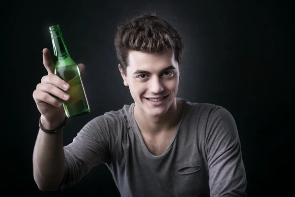 Handsome guy having a beer