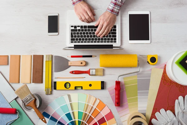 Professional decorator working at desk