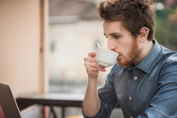 Hipster guy drinking a coffee