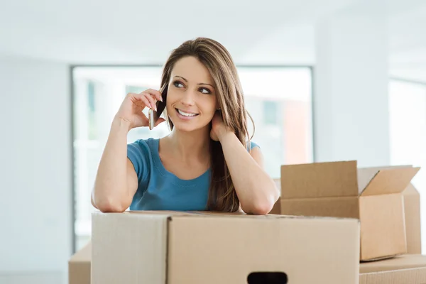 Woman phone calling in her new house