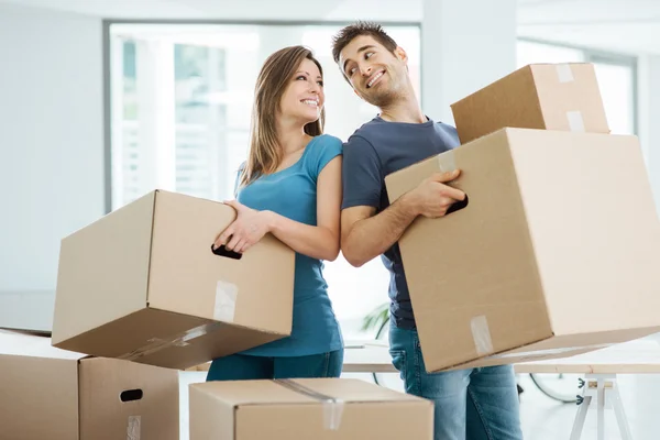 Happy couple moving in their new house