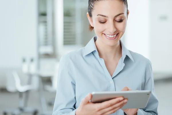 Young business woman using a digital tablet