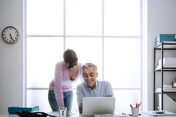 Executive at work with his assistant