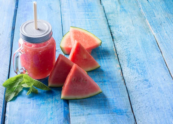 Watermelon smothie on blue background