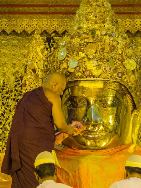 Early morning ritual of face wash to MahaMyat Muni Buddha Image