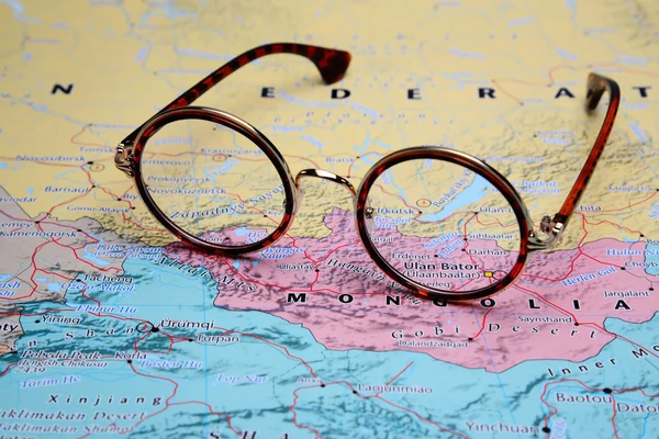 Glasses on a map of Asia - Ulan Bator