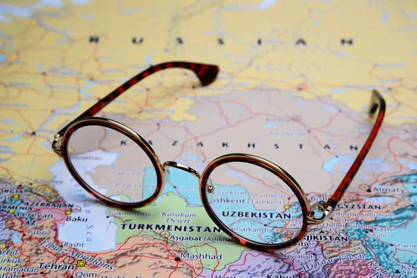 Glasses on a map of Asia - Uzbekistan