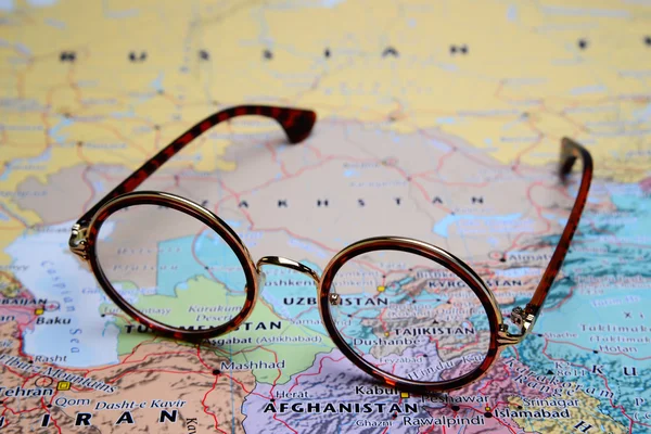 Glasses on a map of Asia - Tajikistan