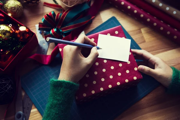 Overhead shot of Christmas presents and wrapping papers