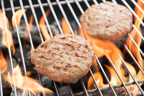 Hamburgers on Grill with Dancing Flames Cooked