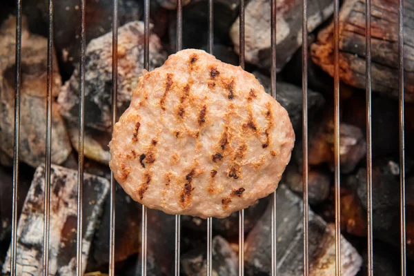 Hamburgers on Grill with Dancing Flames Cooked