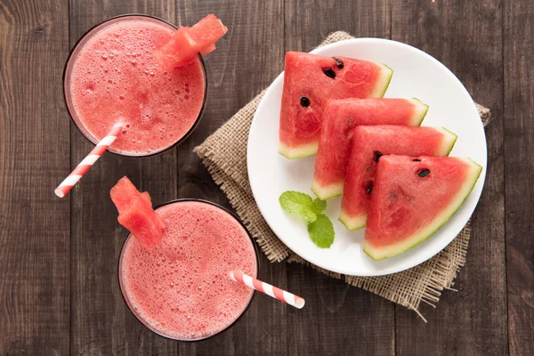 Top view healthy watermelon smoothie on a wood background.