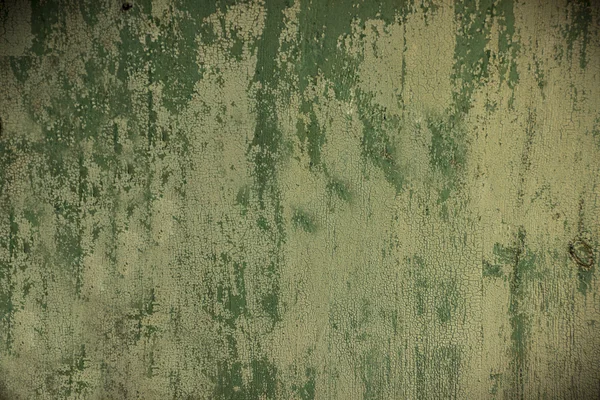 Color paint flaking and cracking texture. Rusty green painted texture.