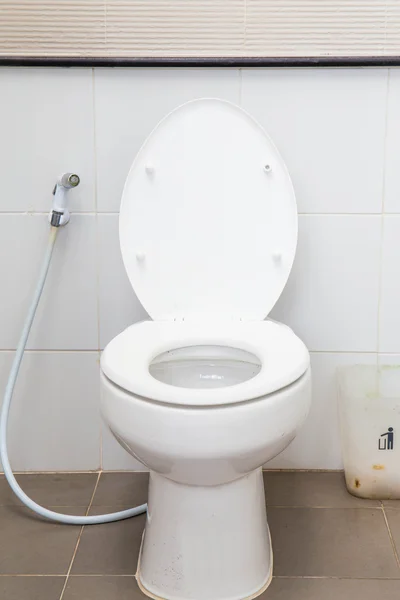 White water closet in toilet.