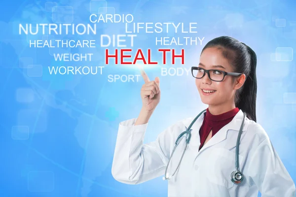 Doctor hand touching HEALTH word on screen with blue background. medical concept