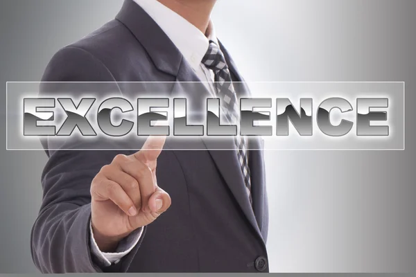 Businessman hand touching excellence word