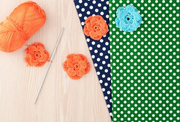 Handmade knitted crochet flowers. Cotton textile for needlework.