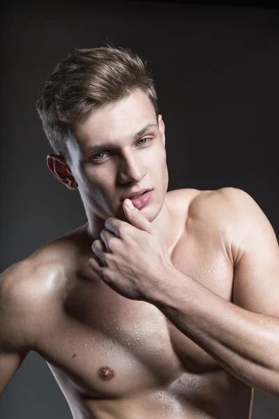 Portrait of young and sexy muscular blond male model