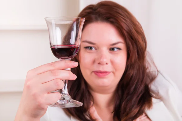 Elegant woman drinking wine