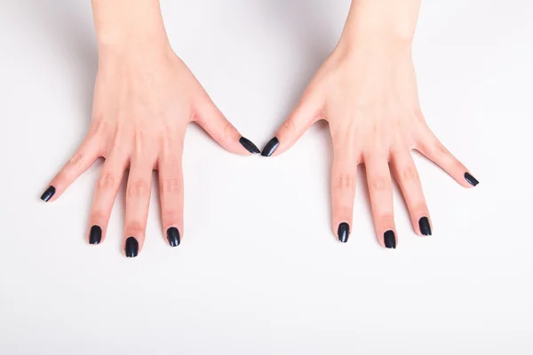 Black nail lacquer manicure