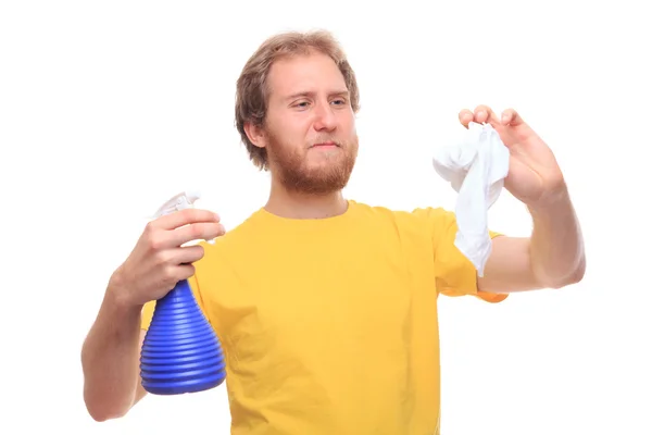 Man cleaning using spray and duster