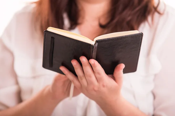 Woman with small notebook