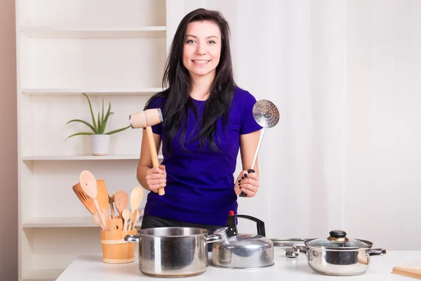 Happy woman cooking in kitchen