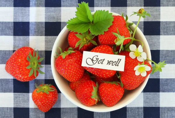 Get well card with bowl of fresh strawberries on checkered cloth