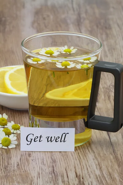 Get well note, chamomile tea and fresh lemon