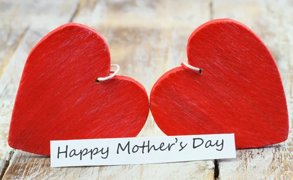 Happy Mother's day card with two red wooden hearts