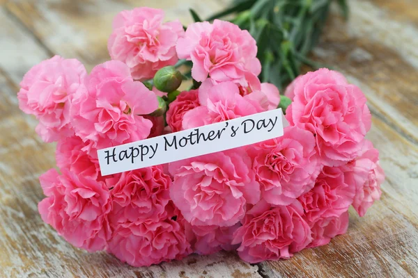 Happy Mother\'s day card with pink carnations bouquet