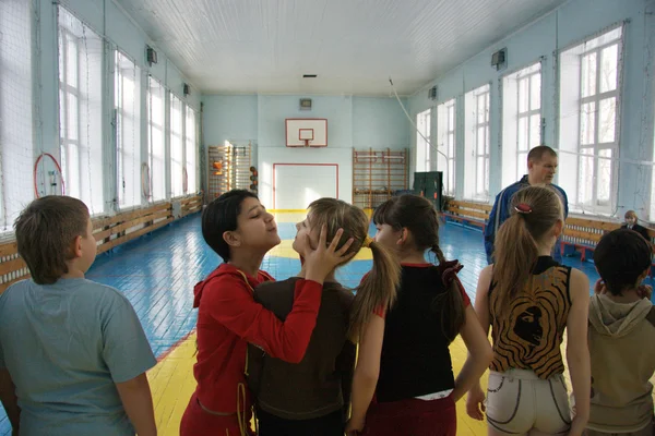 Teenagers at school in physical education