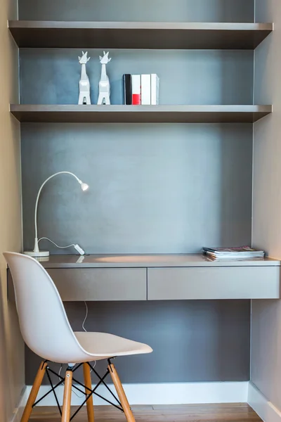 Work desk interior with a lamp and chair