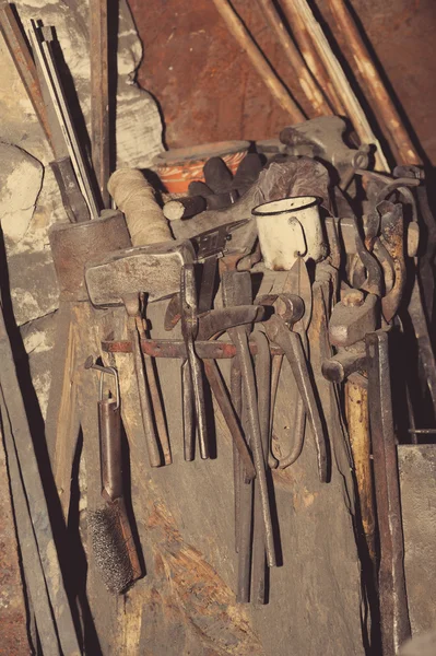 Hammer and anvil, detail of a forge, metal tools
