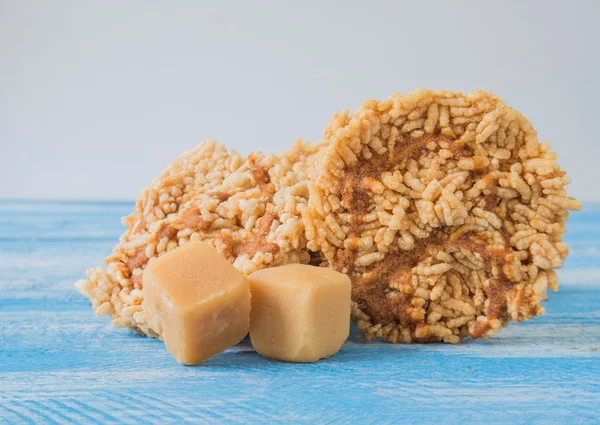 Coconut sugar , Cube sugar , Rice Crackers on Blue background.