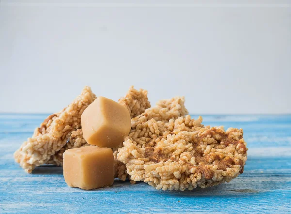 Coconut sugar , Cube sugar , Rice Crackers on Blue background.