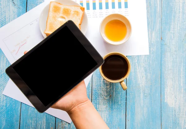 Black display Tablet in hand , Toast , Honey , Coffee cup , Grap
